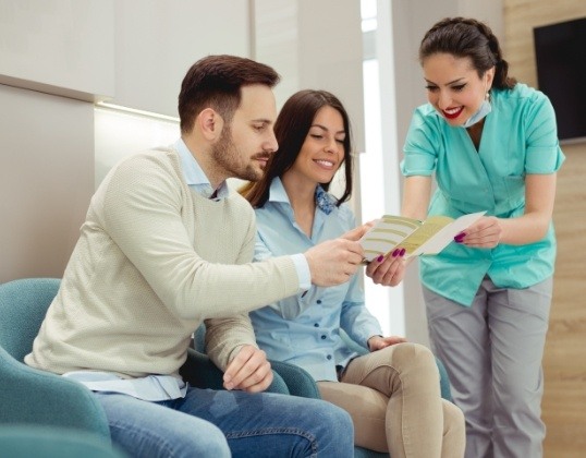 Pediatric dental patient's parents discussing Delta Dental insurance coverage