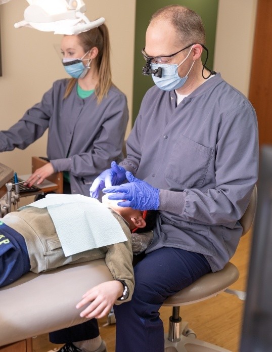 Dentist treating dental patient