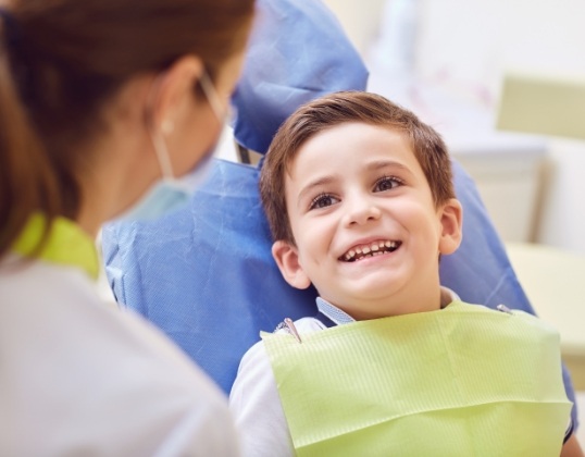Child smiling after resotrative dental care