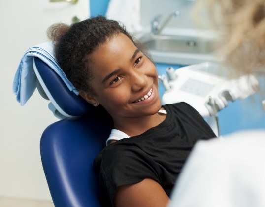Child smiling after cosmetic dental care
