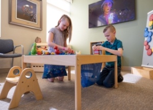 Children playing in pediatric dental office waiting room