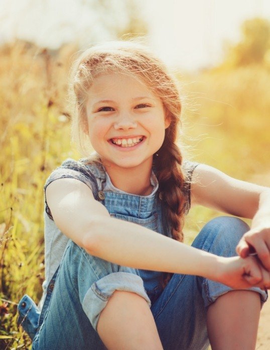 Child smiling after pulp therapy