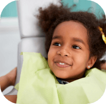 Child smiling during preventive dentistry visit