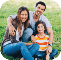 Family smiling after visiting the pediatric dentist