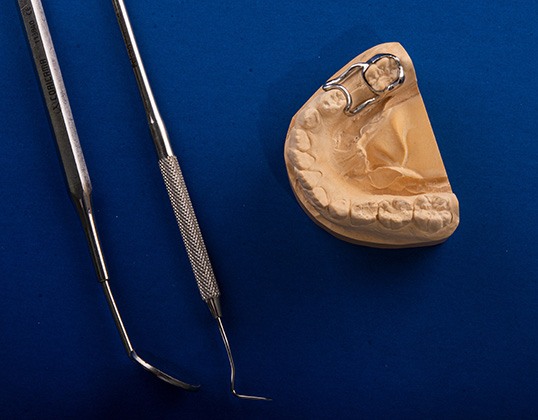 Dental instruments and a mouth mold with a space maintainer