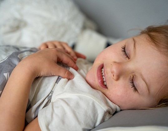 Little girl grinding her teeth while asleep