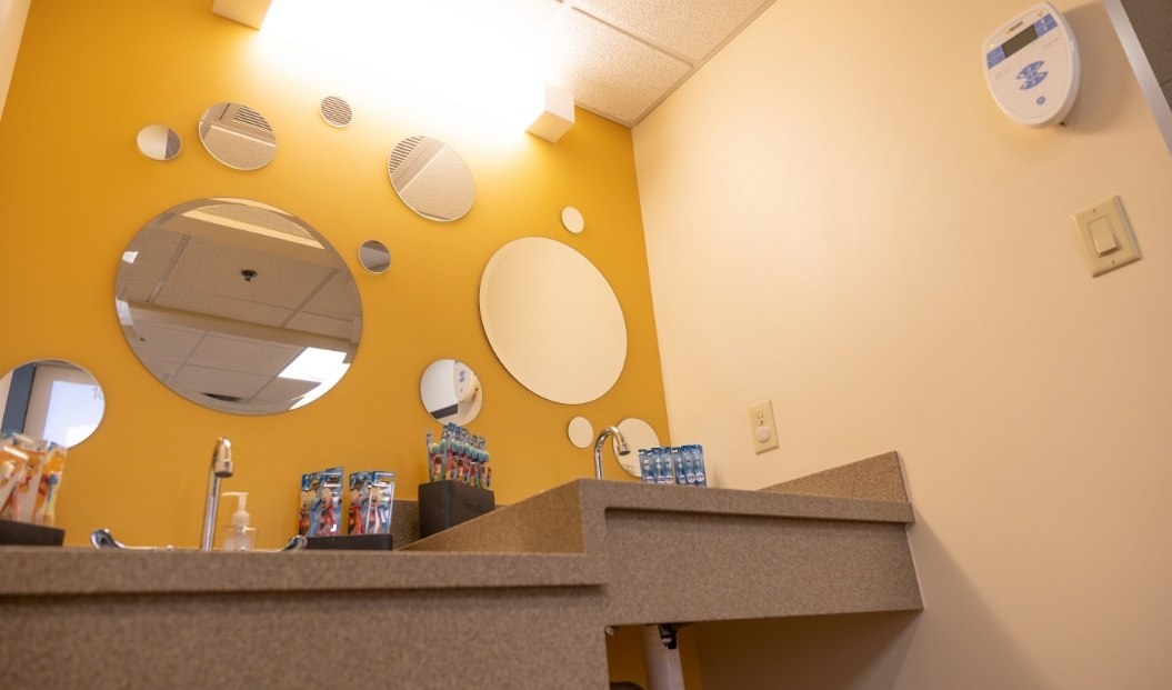 Tooth brushing station in pediatric dental office