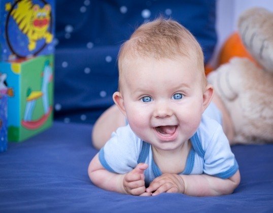 Baby smiling after dentistry for infants