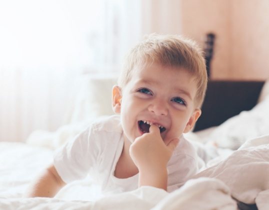 Young child smiling after dentistry for toddlers