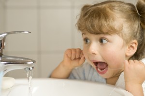 Children’s dentist in Castle Pines educates parents on when their kids should start flossing their teeth.