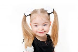 young girl smiling with blond hair