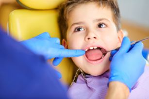 Child getting an oral cancer screening