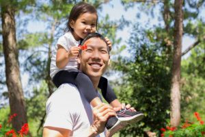 child on parent's shoulders