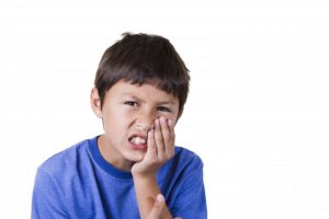 boy with tooth pain