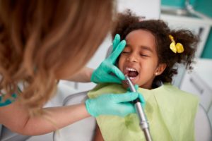little girl getting pulp therapy to save her baby teeth