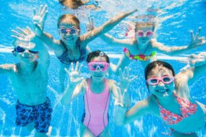 Kids swimming underwater.